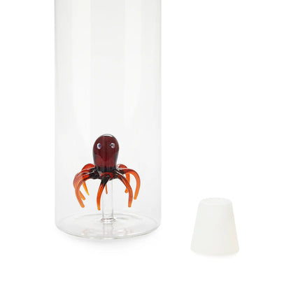 Atlantis Octopus bottle, close-up on the red and orange octopus at the base