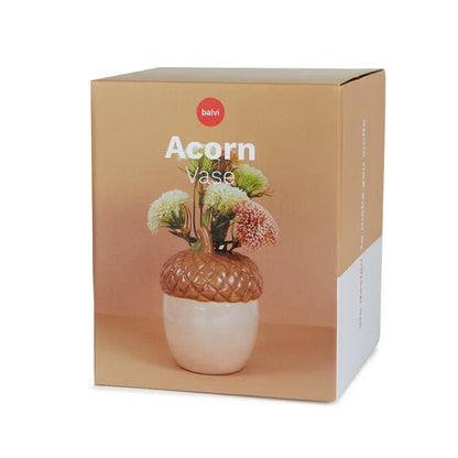 Acorn vase in its box, showing a photo of the vase filled with flowers.