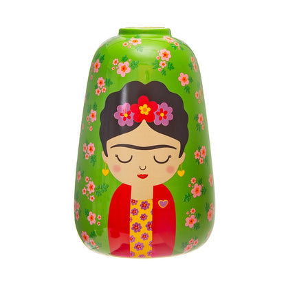 Frida Floral vase in green with a stylised woman's face, dark hair and flowers in the hair, on a pink floral background.