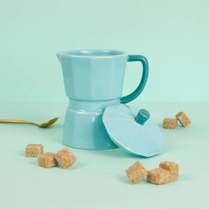 Mint green Moka mug with a dark green handle and the lid on