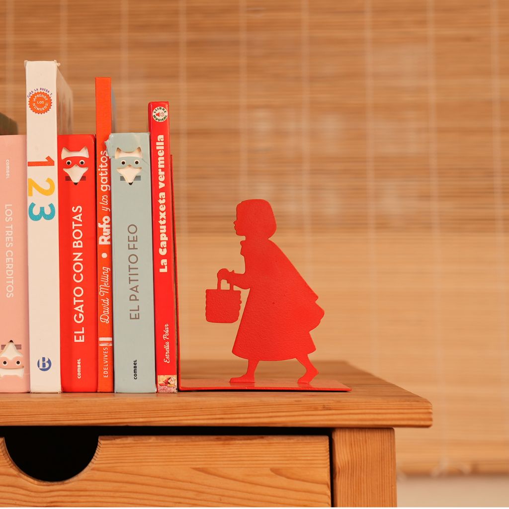 Little Red Bookend: the red silhouette of Little Red Riding Hood holding up the books.