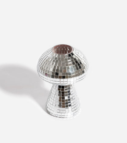 The mirrored mushroom vase from an angle showing the pink cap