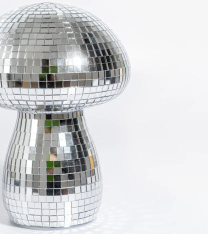 Mini disco mushroom lamp, close-up on the cap with green reflections