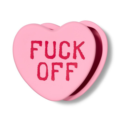 Fuck Off heart-shaped box in pink, seen at an angle with the lid slightly open.