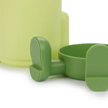 Mr.Sitty pen holder close-up of the green legs and feet at the base of the pot.