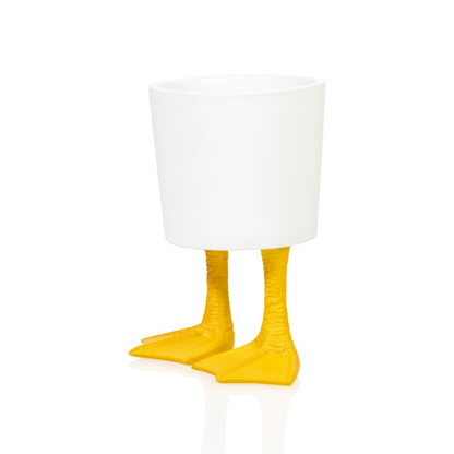 Duck Feet planter in white with yellow feet, empty on a white background.