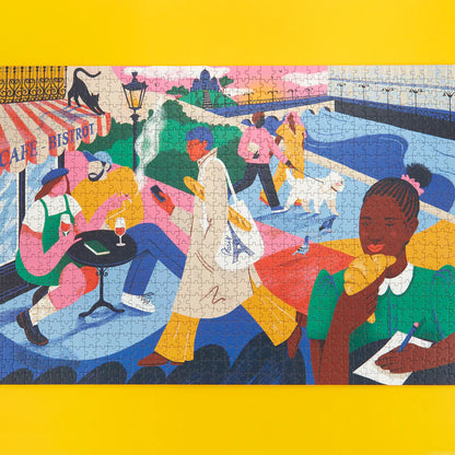 Paris Puzzle assembled, showing an illustration of a café, a bridge and a dog on a lead.