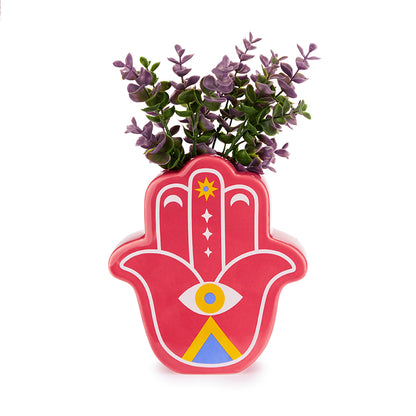 Red Lucky Hand vase with purple leaves on a white background