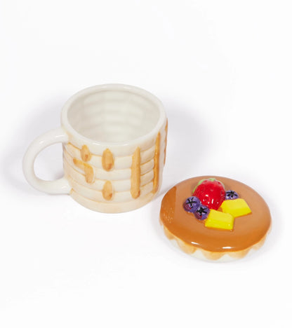 Pancake mug and lid on a table, with the lid detached to show the empty cup