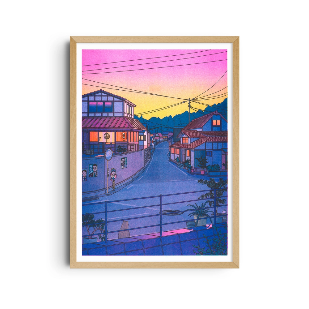 Framed poster of a Japanese street at sunset, with a pink and orange sky