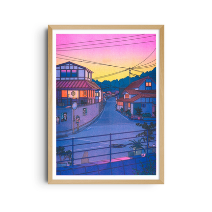 Framed poster of a Japanese street at sunset, with a pink and orange sky