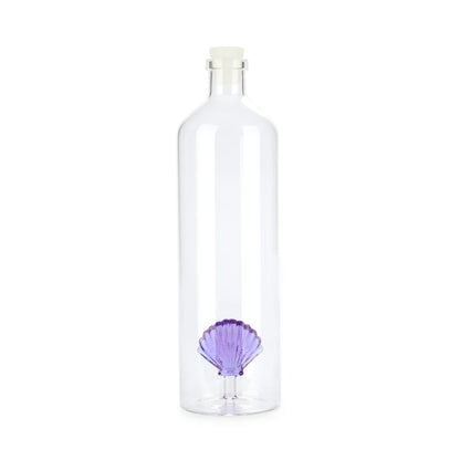Clear glass bottle with a purple seashell detail at the base