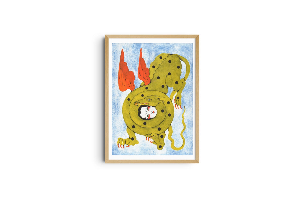 The Kiss poster shown full length in a wooden frame, green winged creature on pale blue