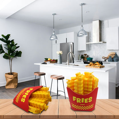 The fries-shaped bag clips resting on a wooden table in a kitchen