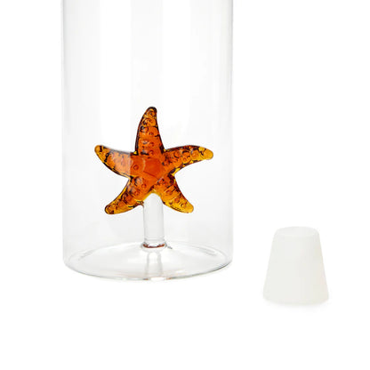 Atlantis Starfish bottle, close-up on the orange starfish at the base