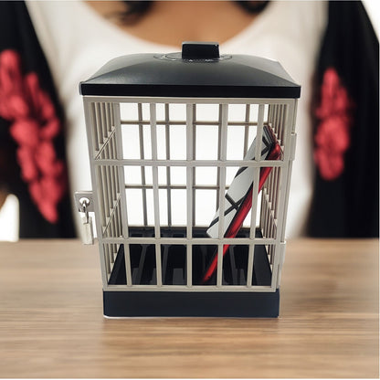 A red smartphone locked inside the cage, on a wooden table