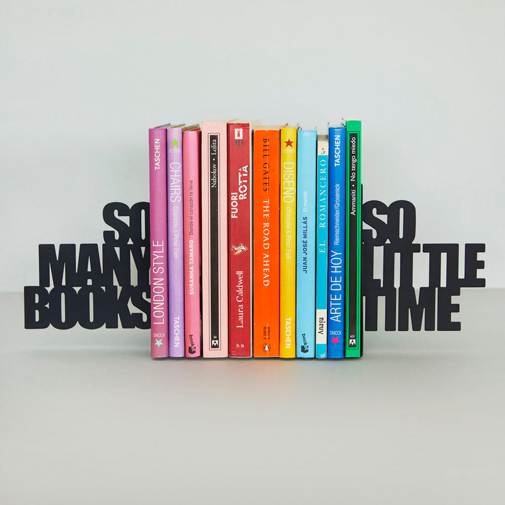 Same lettered bookend on a light grey background, holding colourful books