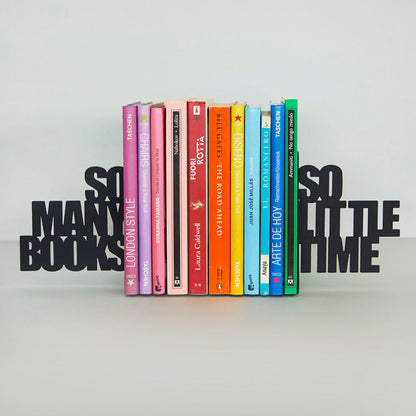 Same lettered bookend on a light grey background, holding colourful books