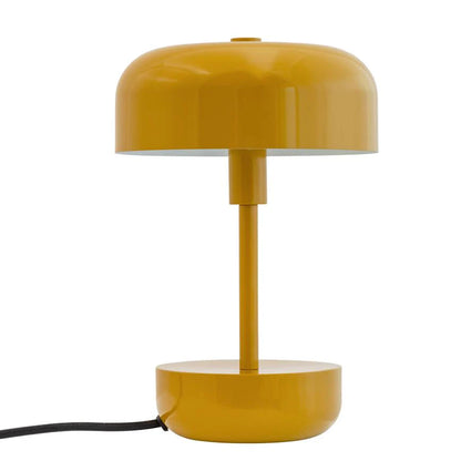 Haipot lamp in mustard yellow, mushroom-shaped, with the black cord visible at the base.