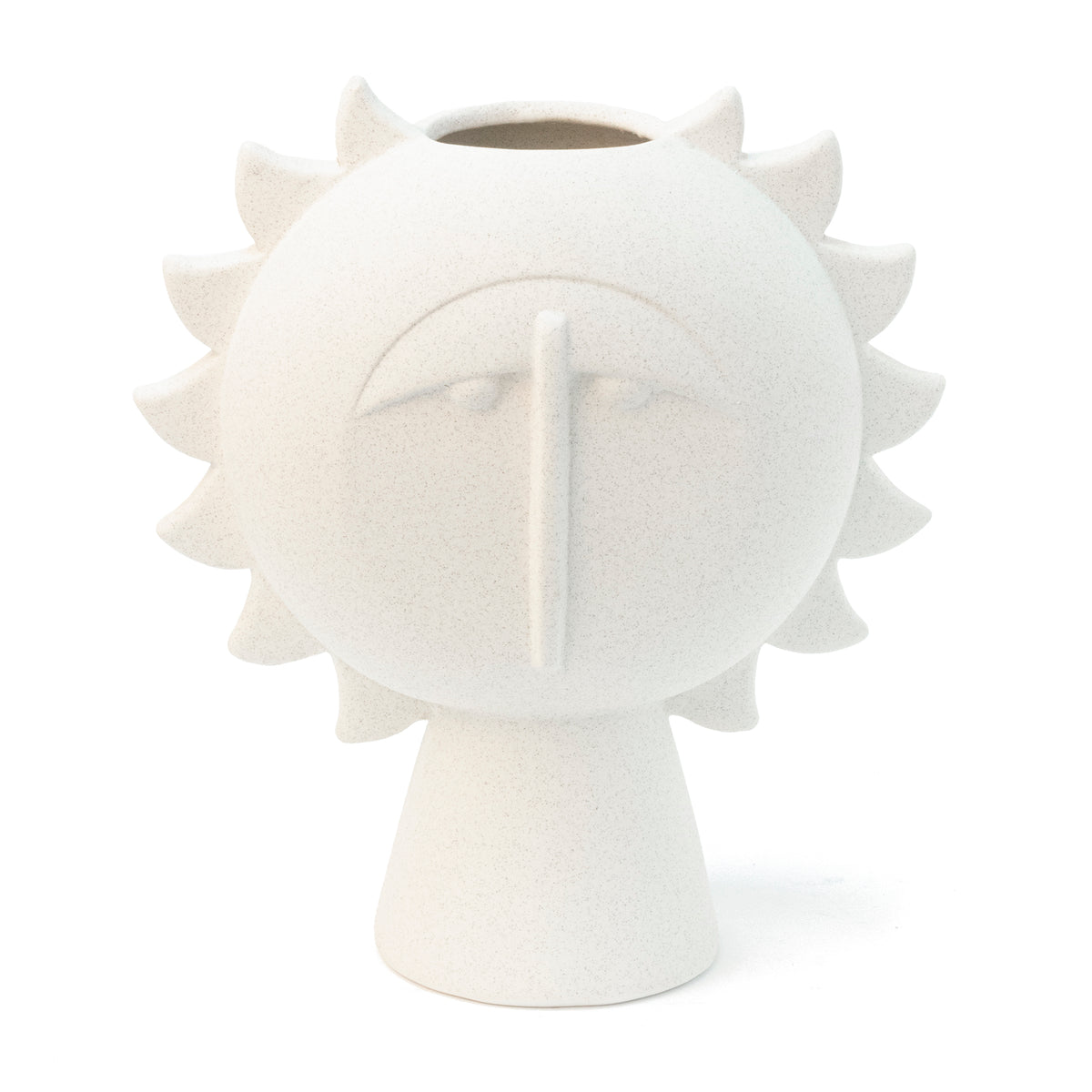 White vase shaped like a radiant face surrounded by spikes, on white