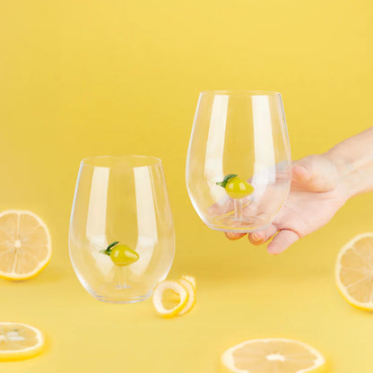 Botanical Lemon Glasses on a yellow background with lemon slices, one held in a hand