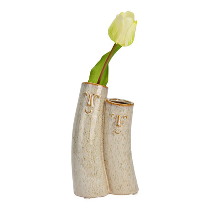 Couple vase with a yellow tulip placed in the taller of the two.
