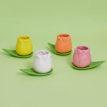 Tulip Multicolore cup set: four tulip-shaped cups on green leaf saucers