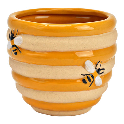 Vaso Alveare: a vase with yellow-and-beige ribbed stripes in a beehive effect, shown empty.