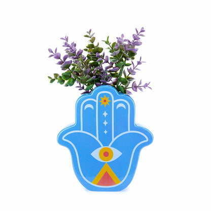 Blue Lucky Hand vase with purple leaves on a white background