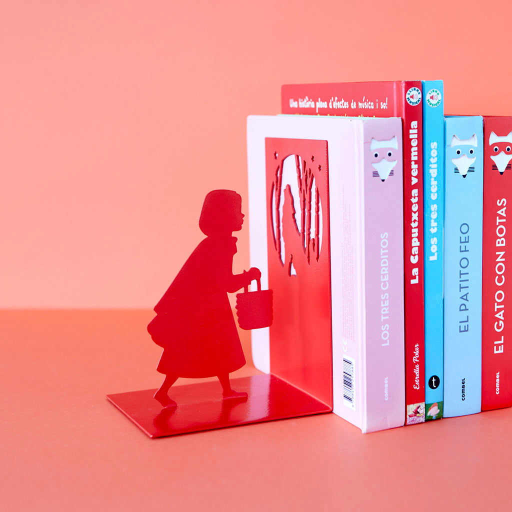 Same Little Red Riding Hood bookend on a coral background, holding children's books