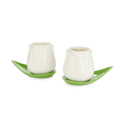 Tulip Coffee Cup Set: the two white tulip cups on green leaf saucers, plain background.