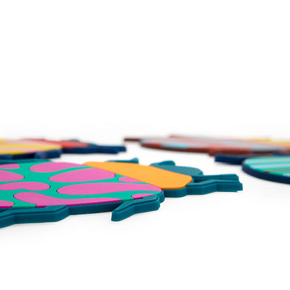 Beetle coasters shown in extreme close-up, with the patterns blurred in the background.