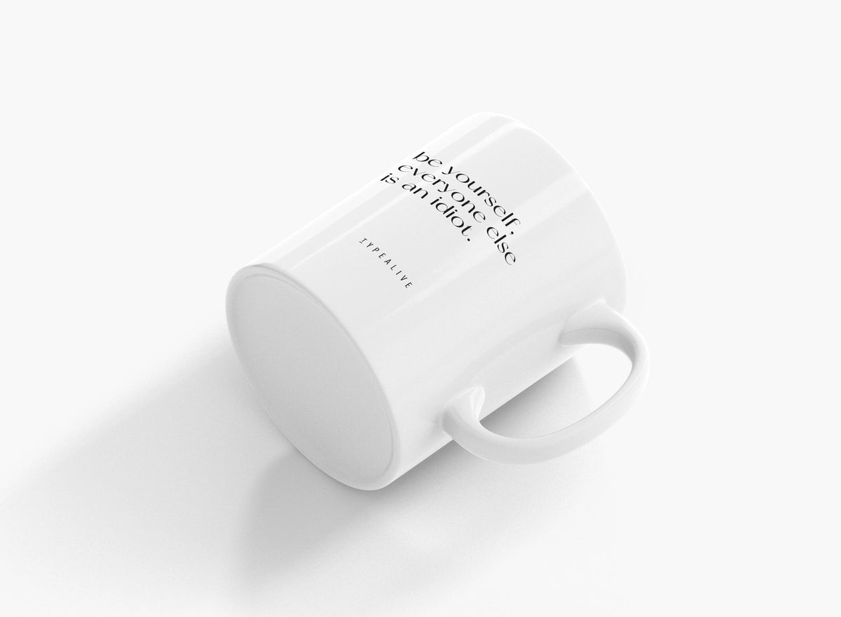 The Be Yourself mug lying on its side, with the handle clearly visible.