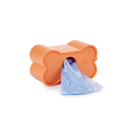 Biscuit dog waste bag holder in peach, seen from the side with the light-blue bag
