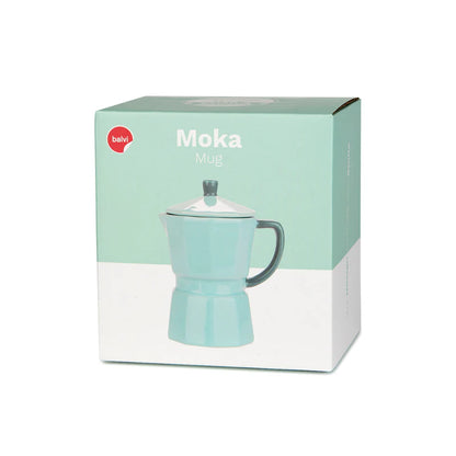 Mint green Moka mug filled with coffee, lid resting beside it