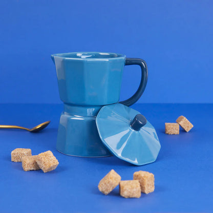 Blue Moka mug with a dark blue handle and the lid on