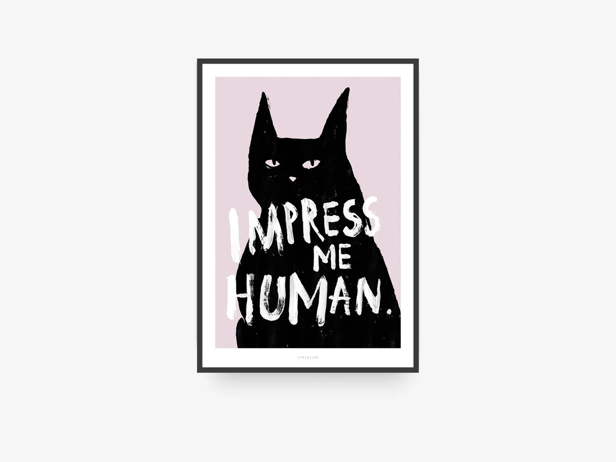 Il poster Impress Me inserito in una cornice nera.