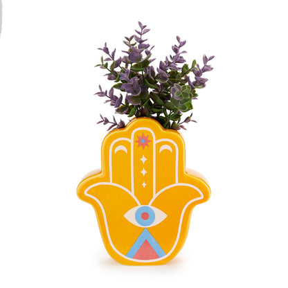 Yellow Lucky Hand vase with purple leaves on a white background