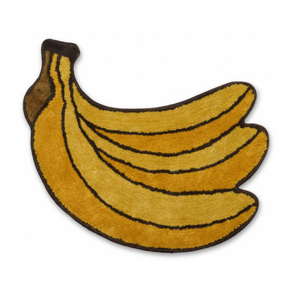Banana Bunch rug: a yellow rug shaped like a bunch of bananas with a brown outline.