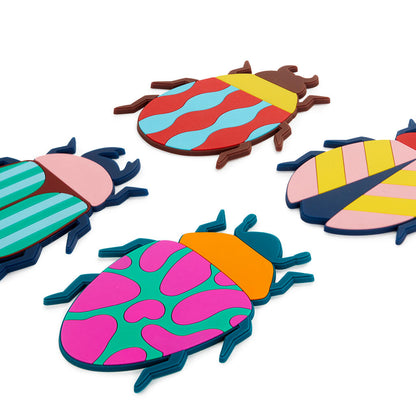Beetle coasters in four different patterns, shown in close-up on a white background.