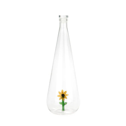 Clear teardrop-shaped Sunflower Bottle, with a sunflower sealed inside the glass