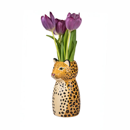 The Leopardo vase with a bunch of purple tulips rising from the animal's head.