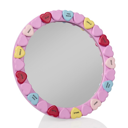 Candy Heart mirror in pink, framed with colourful hearts printed with words.