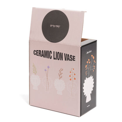 Lion vase, open box reading «Ceramic Lion Vase» with small floral vase illustrations