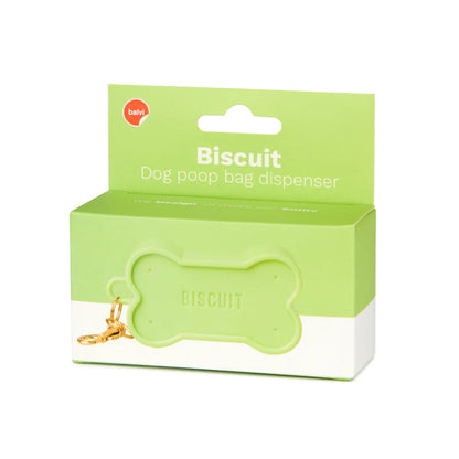 Green Biscuit dog waste bag holder, close-up of a hand pulling the bag out