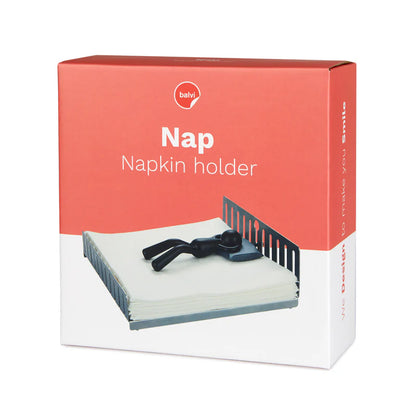 Nap napkin holder in its box, showing a photo of the sleeping figurine.