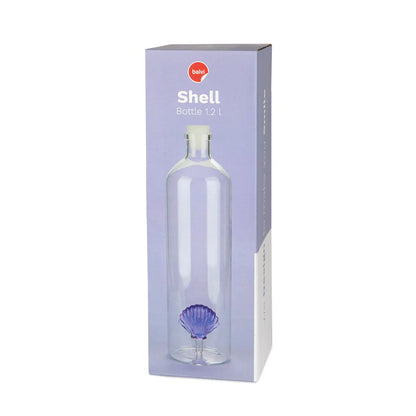 The shell bottle shown in its light purple box