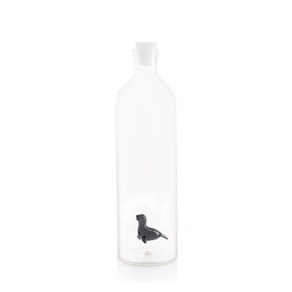 Clear glass bottle with a dark blue seal detail at the base