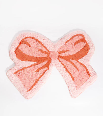 Pink bow-shaped rug, on a white background