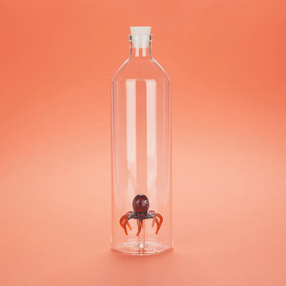 Atlantis Octopus bottle with a white stopper, on an orange background